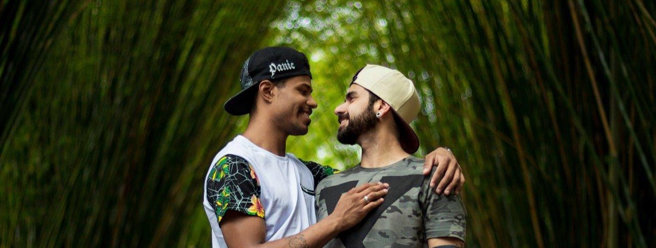 Couple embracing in a forest.